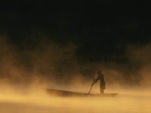 chris-johns-night-fisherman-in-a-dugout-canoe-on-the-zambezi-river
